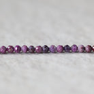 Rare 3mm Stichtite Faceted Round Beads 15"
